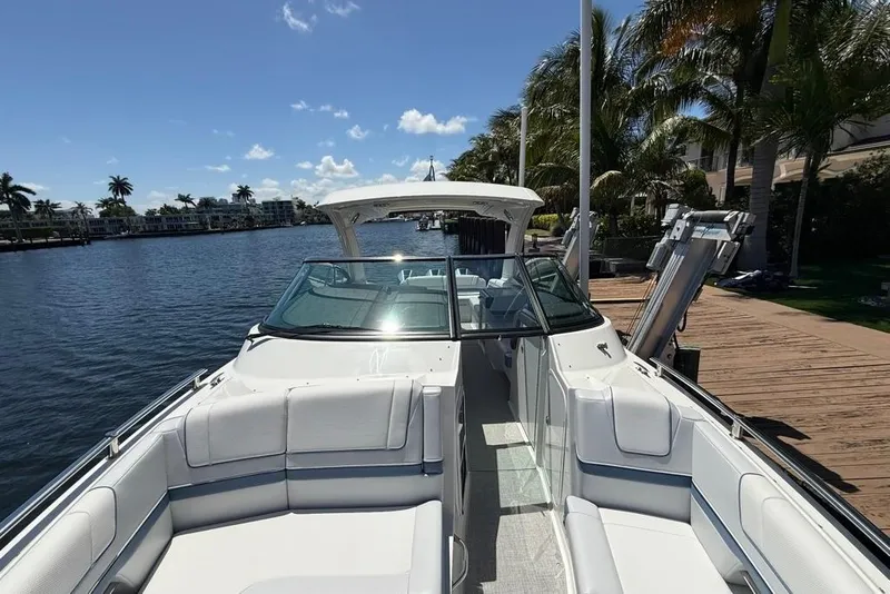 Slide: The Image of 2025 Formula 330 Crossover Bowrider OB, sleek design with modern seating and window detail. - 58