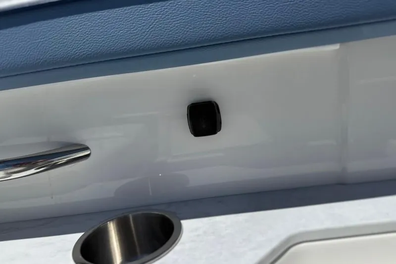 Slide: The Image of Interior detail of 2025 Formula 330 Crossover Bowrider OB, featuring cup holder and handle. - 62