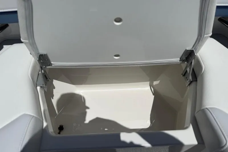 Slide: The Image of Open storage compartment in 2025 Formula 330 Crossover Bowrider OB boat. - 63