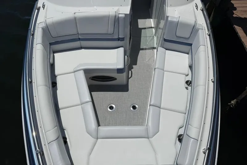 Slide: The Image of 2025 Formula 330 Crossover Bowrider OB docked by a scenic waterfront. - 66