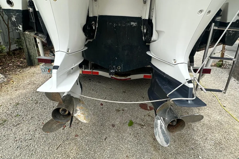 Slide: The Image of Rear view of 2004 Boston Whaler 270 Outrage with dual outboard motors. - 13