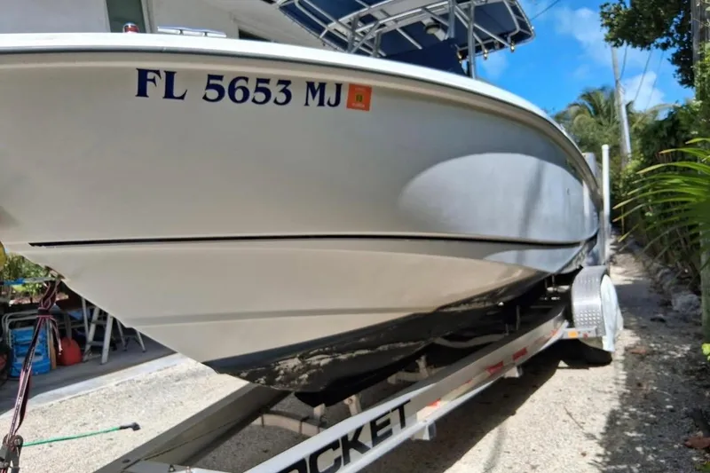 Slide: The Image of 2004 Boston Whaler 270 Outrage boat on trailer, registration FL 5653 MJ. - 17