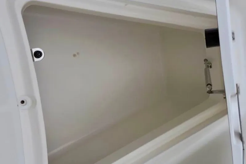 Slide: The Image of Storage compartment of a 2004 Boston Whaler 270 Outrage boat. - 20