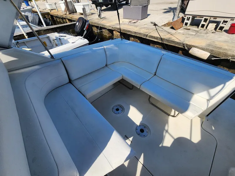 Slide: The Image of 2002 Formula 31 PC boat with spacious white seating area. - 4