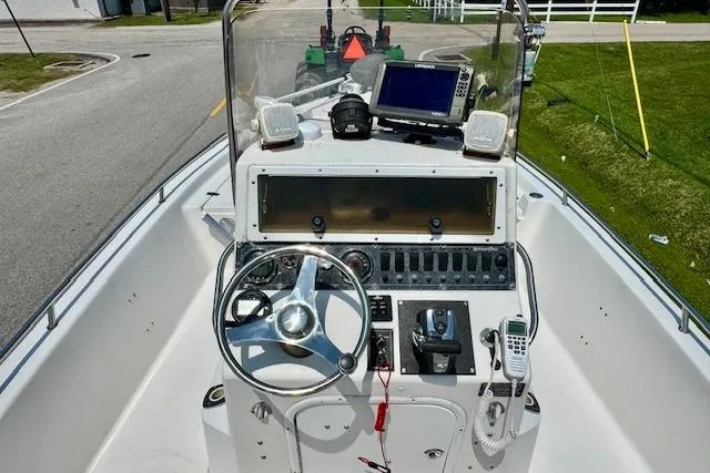 Slide: The Image of 2003 Blazer Bay 2220 Fisherman boat console with steering wheel and navigation equipment. - 10