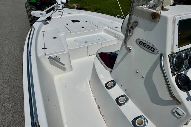 Slide: The Image of 2003 Blazer Bay 2220 Fisherman boat interior with control panel and seating area. - 11