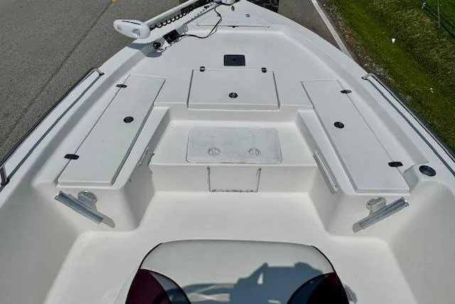 Slide: The Image of 2003 Blazer Bay 2220 Fisherman boat deck with storage compartments and seating. - 12