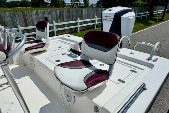Slide: The Image of 2003 Blazer Bay 2220 Fisherman boat with maroon and white seating, Evinrude 250 HP engine. - 7