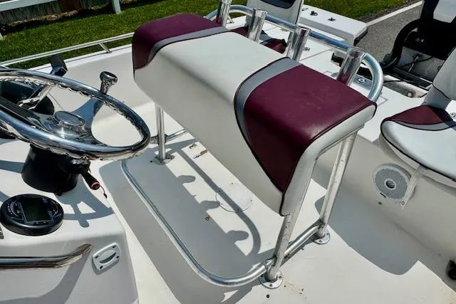 Slide: The Image of 2003 Blazer Bay 2220 Fisherman boat interior with steering wheel and seating. - 9