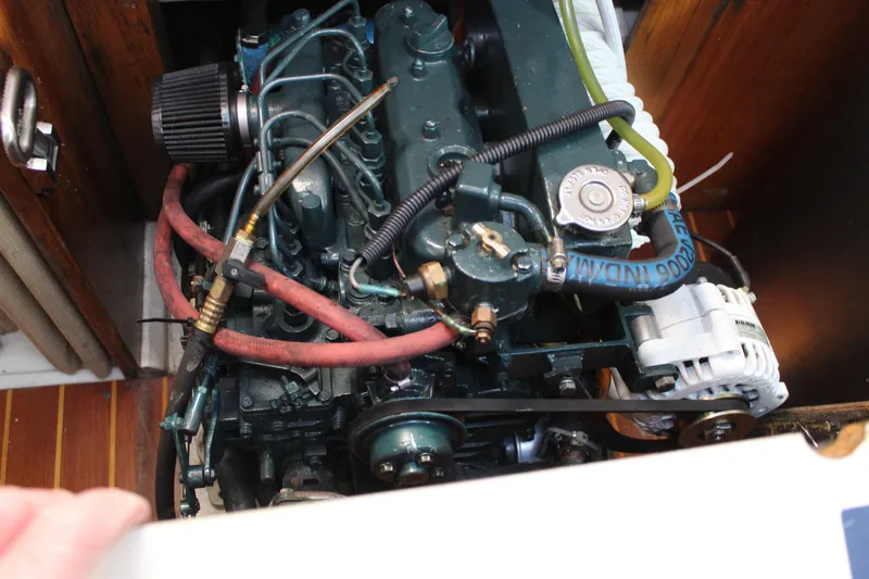 Slide: The Image of Engine compartment of a 1991 Catalina 36 MkII sailboat, showing detailed mechanical components. - 14