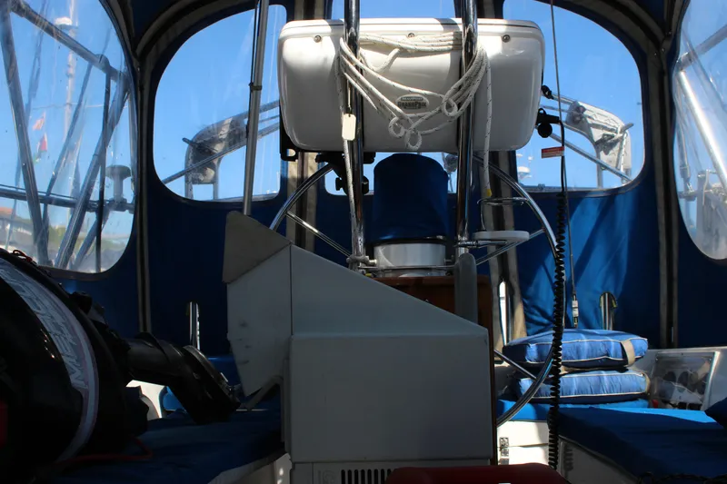 Slide: The Image of Interior view of a 1991 Catalina 36 MkII sailboat cockpit with blue seating and steering wheel. - 15