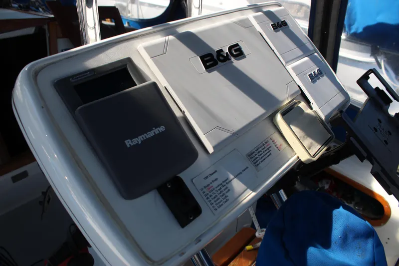 Slide: The Image of Navigation equipment on a 1991 Catalina 36 MkII sailboat, featuring B&G and Raymarine devices. - 16