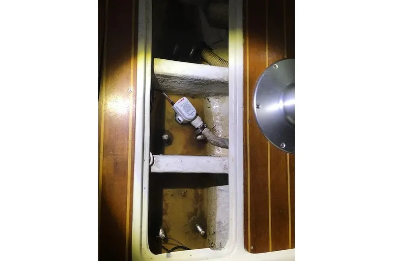 Slide: The Image of Bilge area of a 1991 Catalina 36 MkII sailboat, showing pump and hoses. - 19