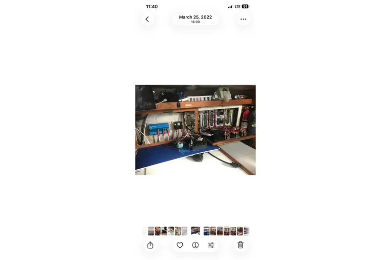 Slide: The Image of Electrical panel inside a 1991 Catalina 36 MkII sailboat, showcasing wiring and components. - 21