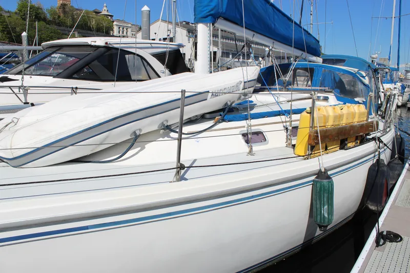 Slide: The Image of Catalina 36 MkII 1991 sailboat docked with blue cover and equipment on deck. - 4