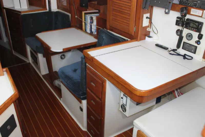 Slide: The Image of Interior of a 1991 Catalina 36 MkII sailboat with wooden accents and navigation equipment. - 7
