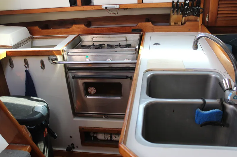 Slide: The Image of Galley kitchen in 1991 Catalina 36 MkII sailboat with stove and double sink. - 8