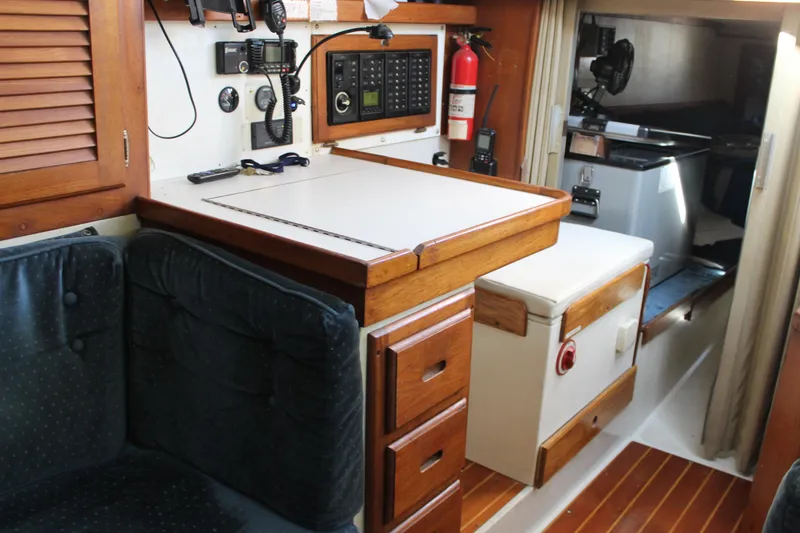Slide: The Image of Interior of a 1991 Catalina 36 MkII sailboat with navigation station and wooden cabinetry. - 9