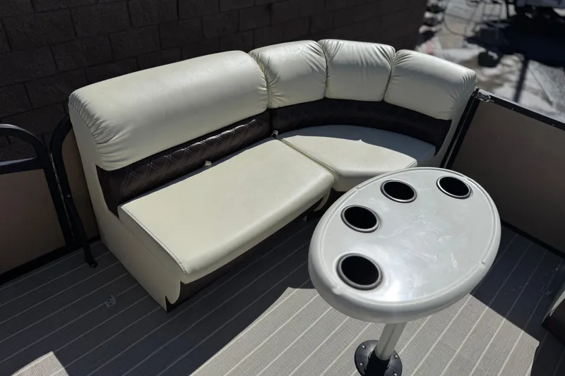 Slide: The Image of Luxurious seating and table on 2023 Lexington 623 ST Xtreme boat. - 13