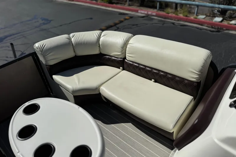 Slide: The Image of 2023 Lexington 623 ST Xtreme boat interior with plush seating and cup holders. - 14