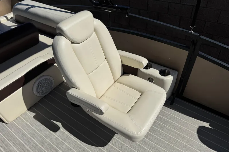 Slide: The Image of Luxurious seating on 2023 Lexington 623 ST Xtreme boat, featuring plush white upholstery and cup holders. - 16