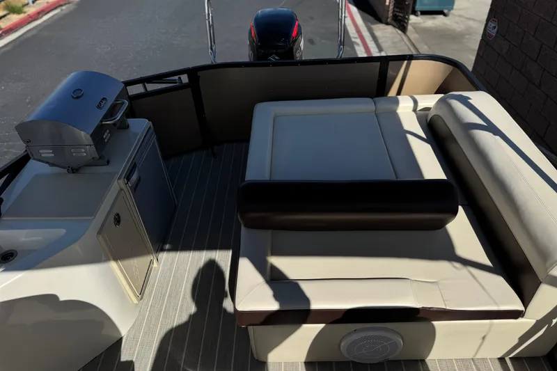 Slide: The Image of 2023 Lexington 623 ST Xtreme boat interior with seating and grill on deck. - 17