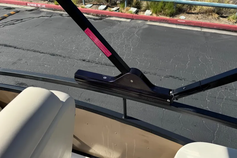 Slide: The Image of 2023 Lexington 623 ST Xtreme boat interior with beige seating and black railing. - 28