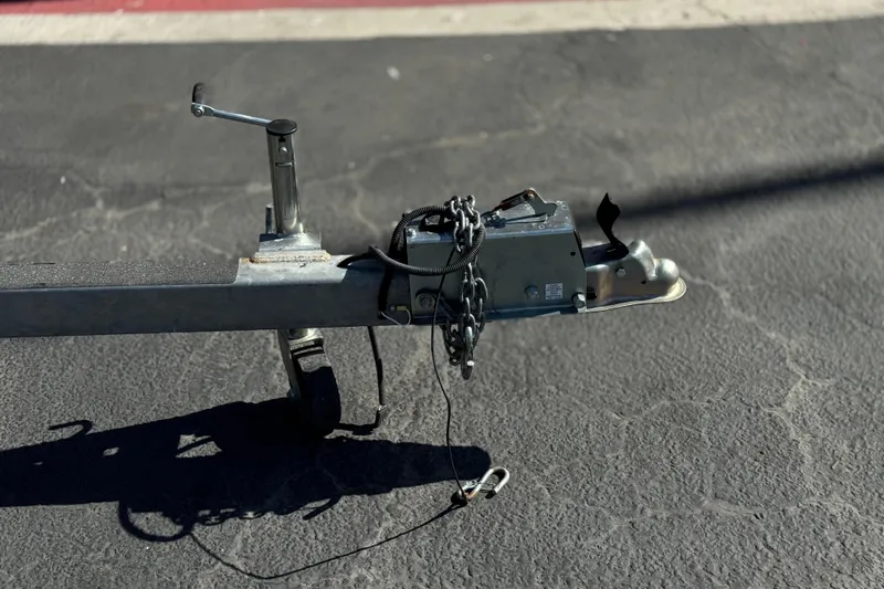 Slide: The Image of Trailer hitch of a 2023 Lexington 623 ST Xtreme on asphalt pavement. - 30