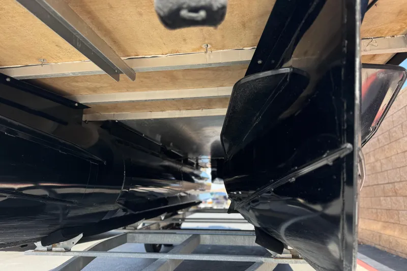 Slide: The Image of Underneath view of a 2023 Lexington 623 ST Xtreme boat on a trailer. - 4