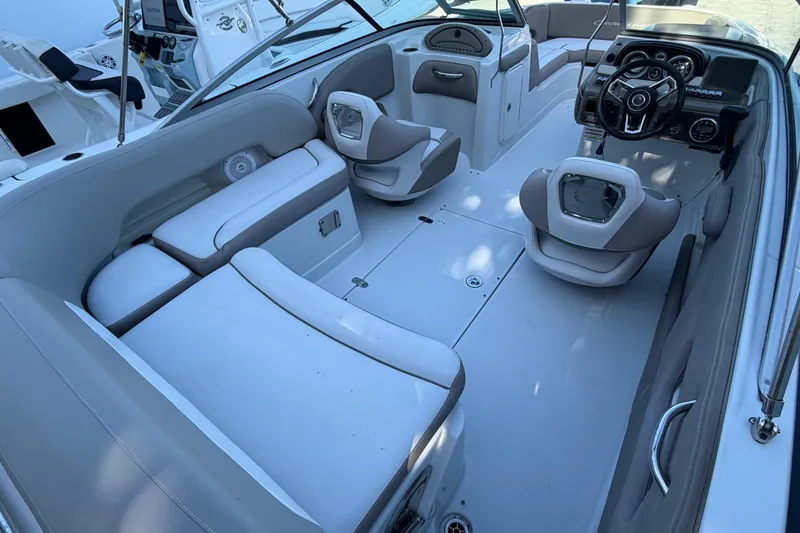 Slide: The Image of 2019 Crownline Eclipse E215 XS boat interior with modern seating and steering console. - 5