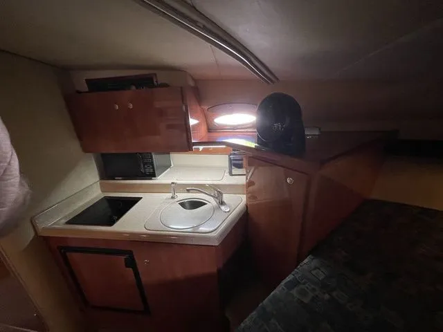 Slide: The Image of Interior of 2006 Cruisers Yachts 280CXI Express Cruiser, kitchen with sink. - 18