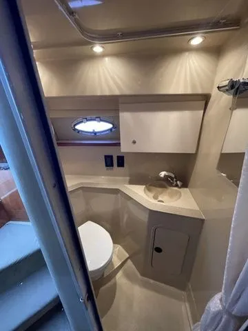 Slide: The Image of Interior view of 2006 Cruisers Yachts 280CXI Express Cruiser bathroom. - 23