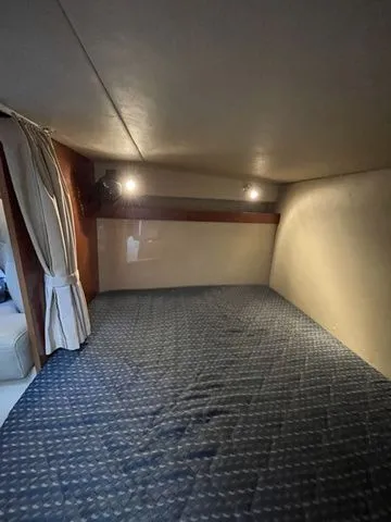 Slide: The Image of Interior of 2006 Cruisers Yachts 280CXI Express Cruiser, cozy sleeping cabin. - 3