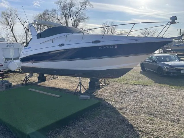 Slide: The Image of 2006 Cruisers Yachts 280CXI Express Cruiser on stands outdoors. - 38