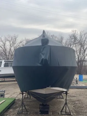 Slide: The Image of 2006 Cruisers Yachts 280CXI Express Cruiser covered on a boat storage lot. - 47