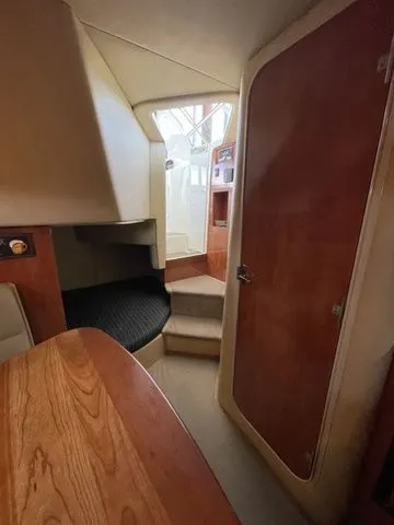 Slide: The Image of Interior of 2006 Cruisers Yachts 280CXI Express Cruiser with wood finish. - 8