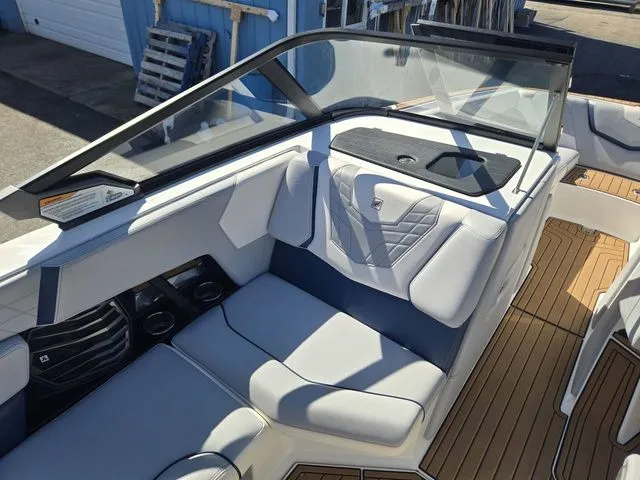 Slide: The Image of Interior of a 2021 Nautique Super Air Nautique G23 boat with luxurious seating. - 10