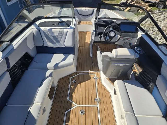 Slide: The Image of Interior of a 2021 Nautique Super Air Nautique G23 boat with luxurious design. - 13