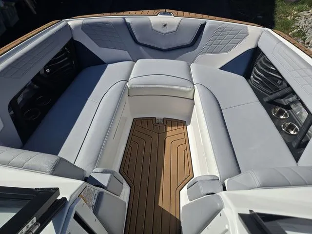 Slide: The Image of Interior of 2021 Nautique Super Air Nautique G23 with luxurious seating. - 15