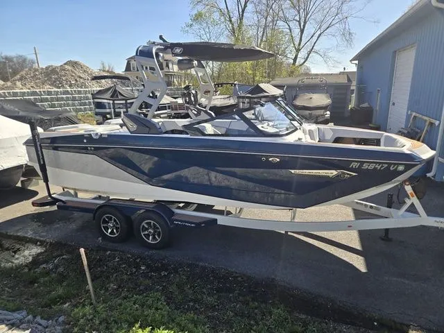 Slide: The Image of 2021 Nautique Super Air Nautique G23 on trailer, side view. - 4