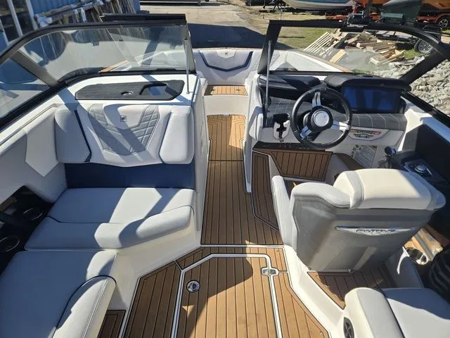 Slide: The Image of Interior of a 2021 Nautique Super Air Nautique G23 boat with luxurious features. - 8