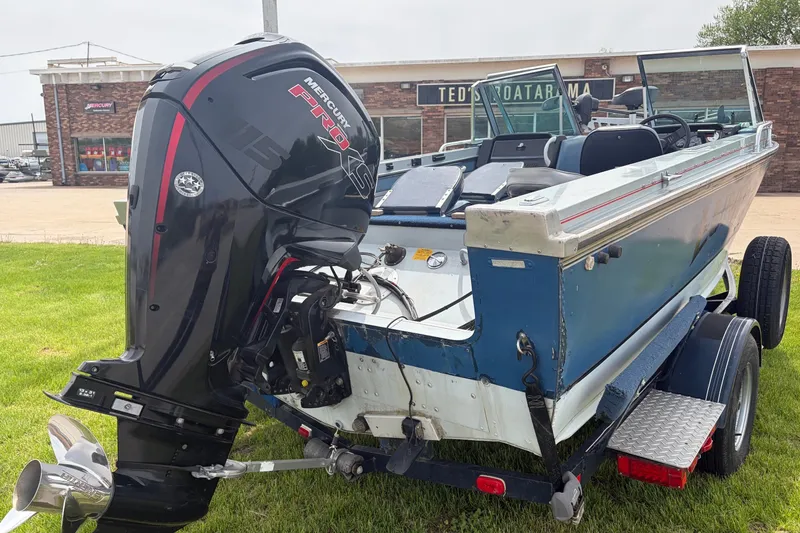 Slide: The Image of 1991 Lund 1750 Tyee boat with Mercury Pro XS outboard motor on trailer. - 11