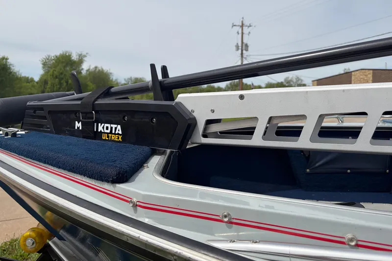 Slide: The Image of 1991 Lund 1750 Tyee boat with Minn Kota Ultrex trolling motor, outdoor setting. - 18