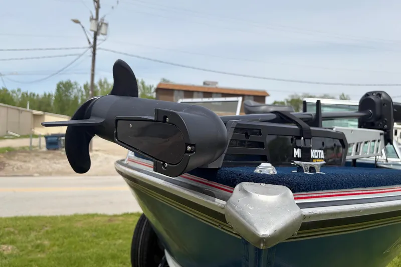 Slide: The Image of 1991 Lund 1750 Tyee boat with Minn Kota trolling motor, parked outdoors. - 20