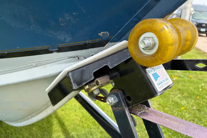 Slide: The Image of Close-up of a 1991 Lund 1750 Tyee boat trailer roller mechanism. - 21