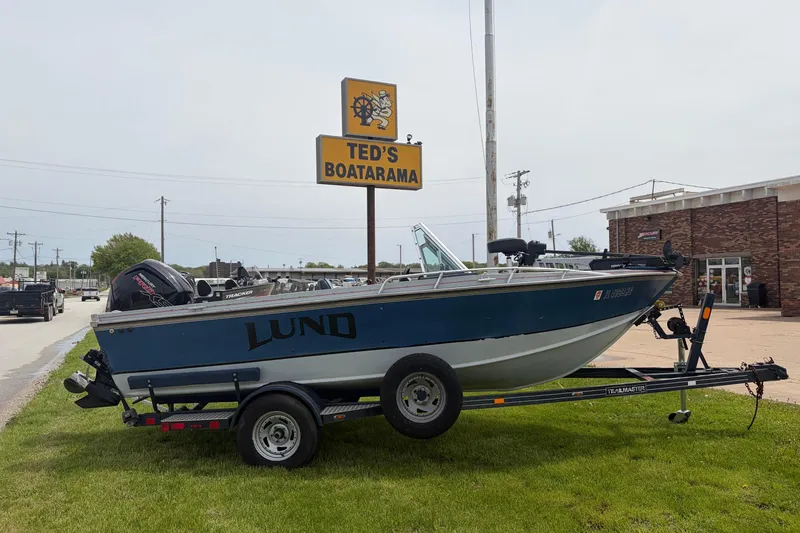 Slide: The Image of 1991 Lund 1750 Tyee boat on trailer at Ted's Boatarama dealership. - 6