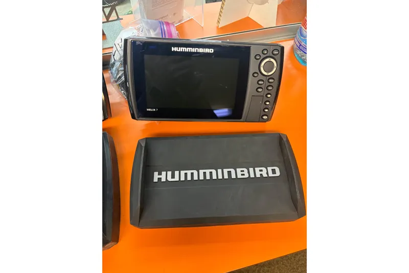 Slide: The Image of Humminbird Helix 7 fish finder on orange surface, compatible with 1991 Lund 1750 Tyee. - 8