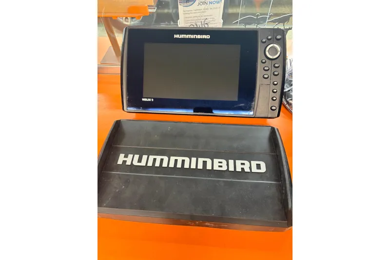 Slide: The Image of Humminbird Helix 9 fish finder on orange surface, compatible with 1991 Lund 1750 Tyee. - 9