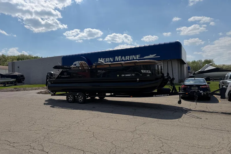 The Image of 2020 Regency 250 LE3 Sport boat on trailer at Hern Marine dealership. - 0