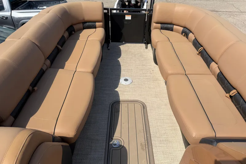 Slide: The Image of Luxurious seating on 2020 Regency 250 LE3 Sport pontoon boat, featuring tan upholstery. - 11